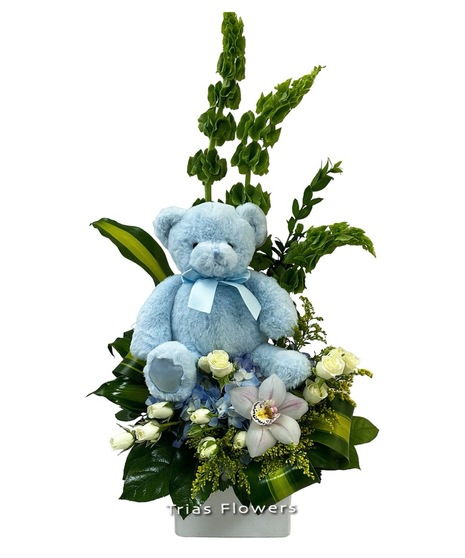 baby blue bear in dramatic modern floral arrangement