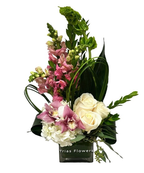 elegant petite arrangement with orchids, roses, and snapdragons in cream and pink