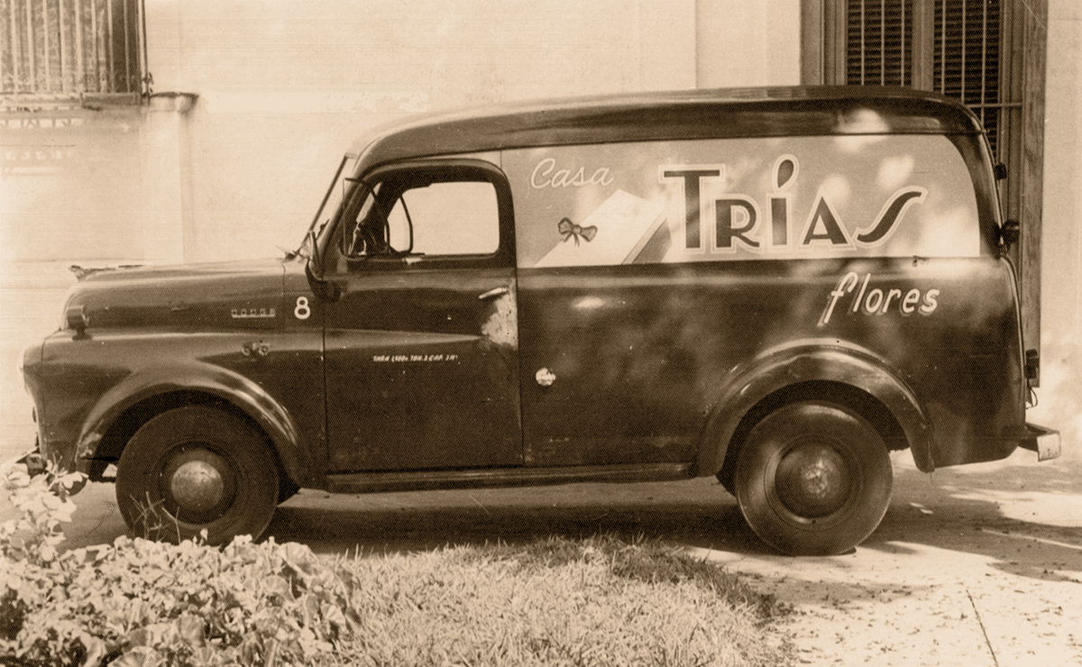 One of our earliest delivery vans, painted with the Trias insignia, from the early 20th century