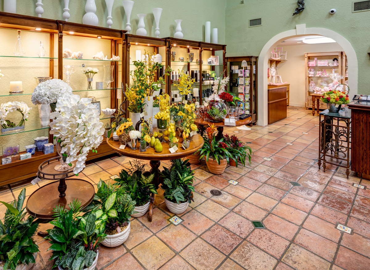 A wide range of colorful floral arrangements, awaiting their new home